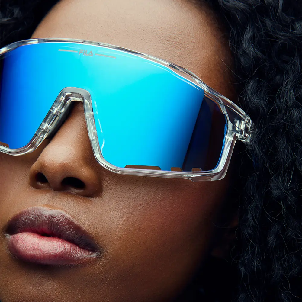 Man and woman in Performance sunglasses with mirrored purple and orange polarized lenses.